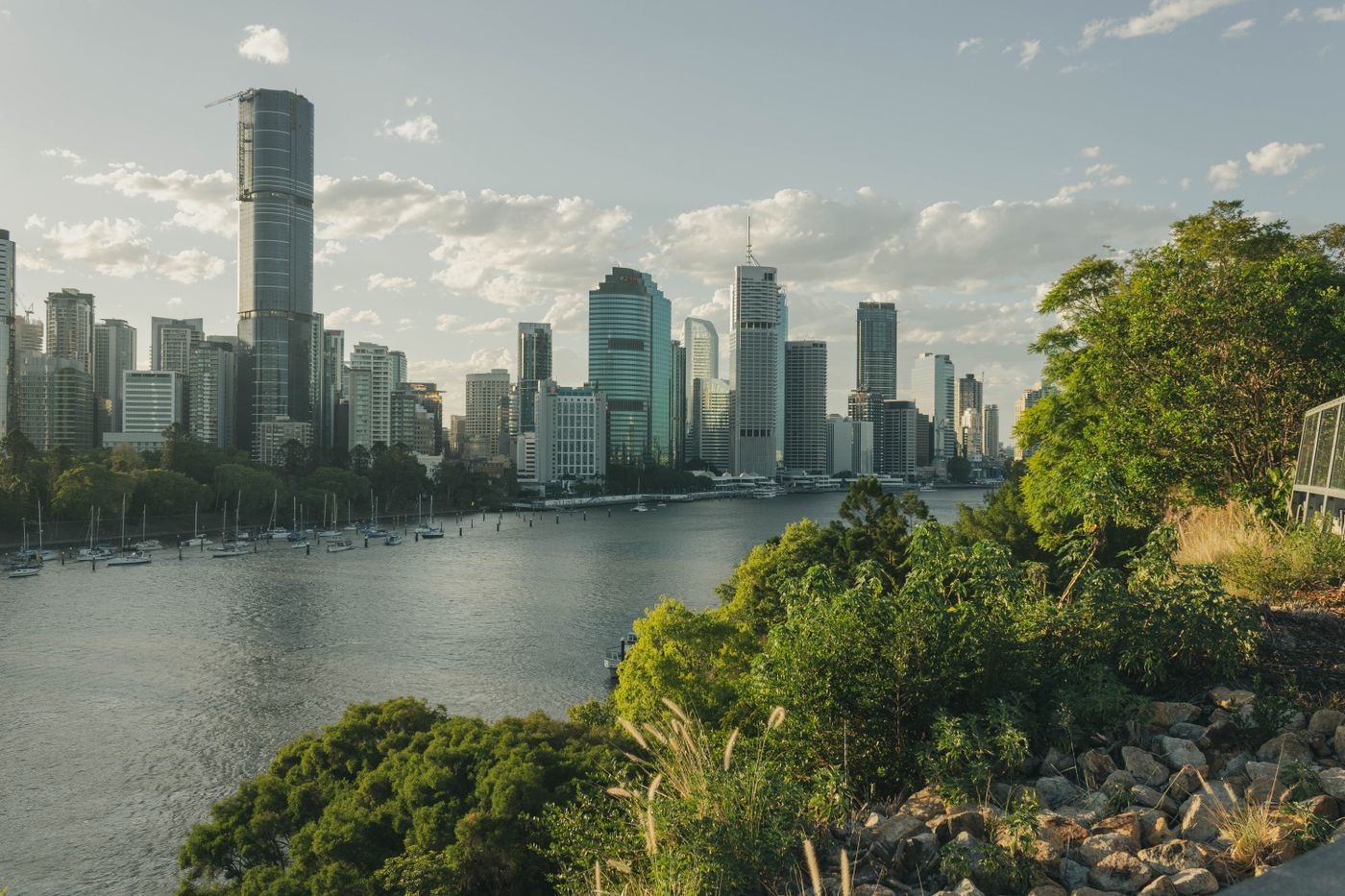 The Brisbane River curving past city towers and leafy riverbanks