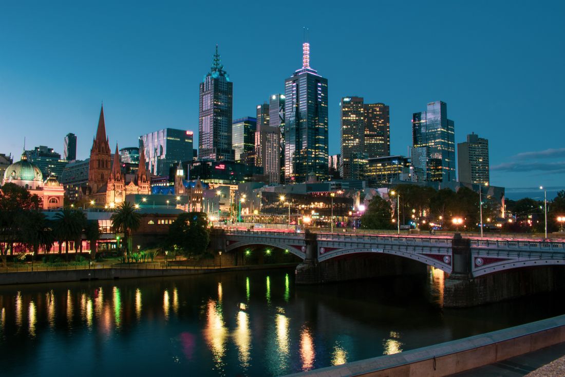 Melbourne's skyline and Princes Bridge reflected in the Yarra at twilight